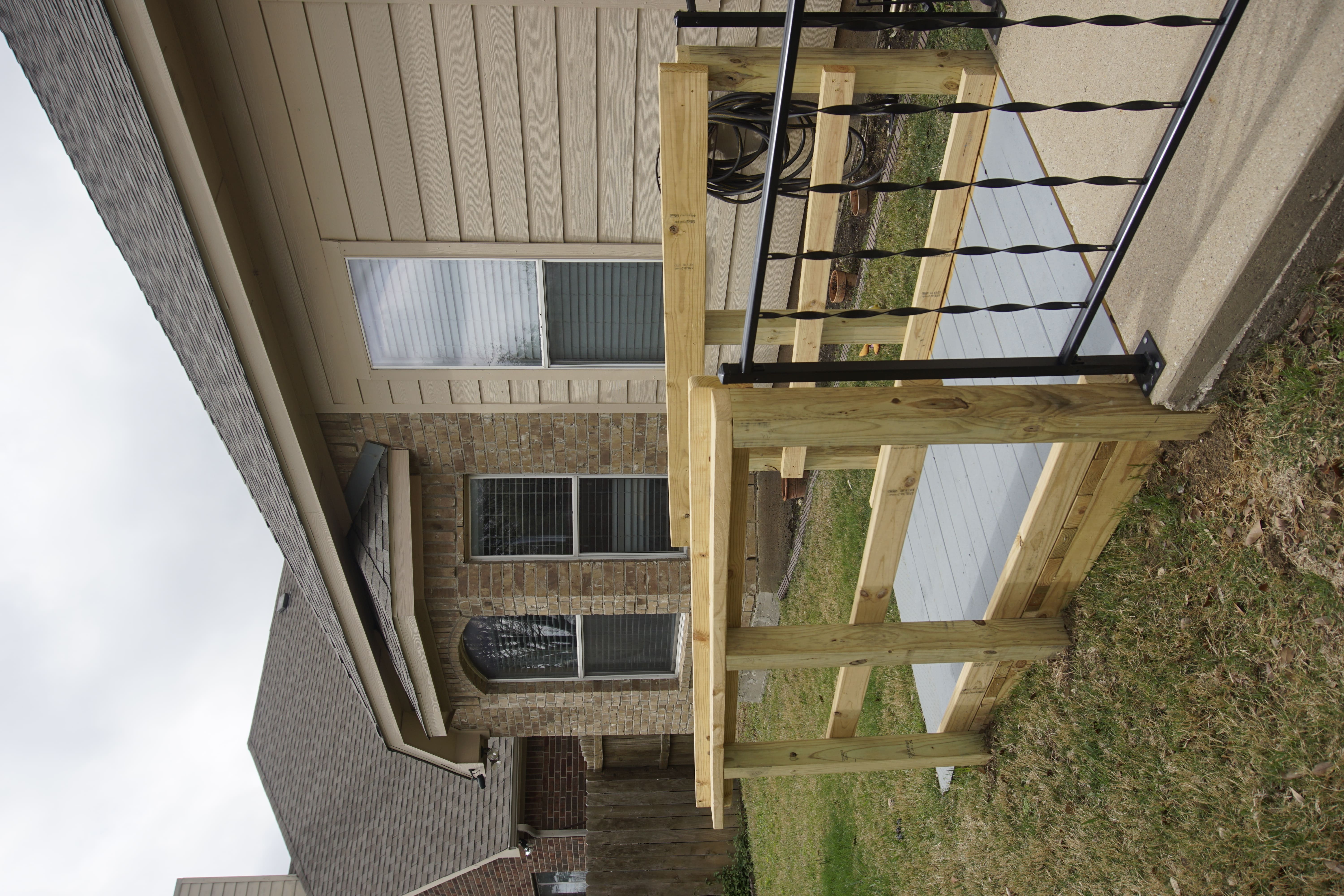 Wooden platform and railing system providing accessible entry to a home porch