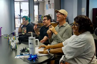 Independent Living Program — diverse group collaborating at a community table